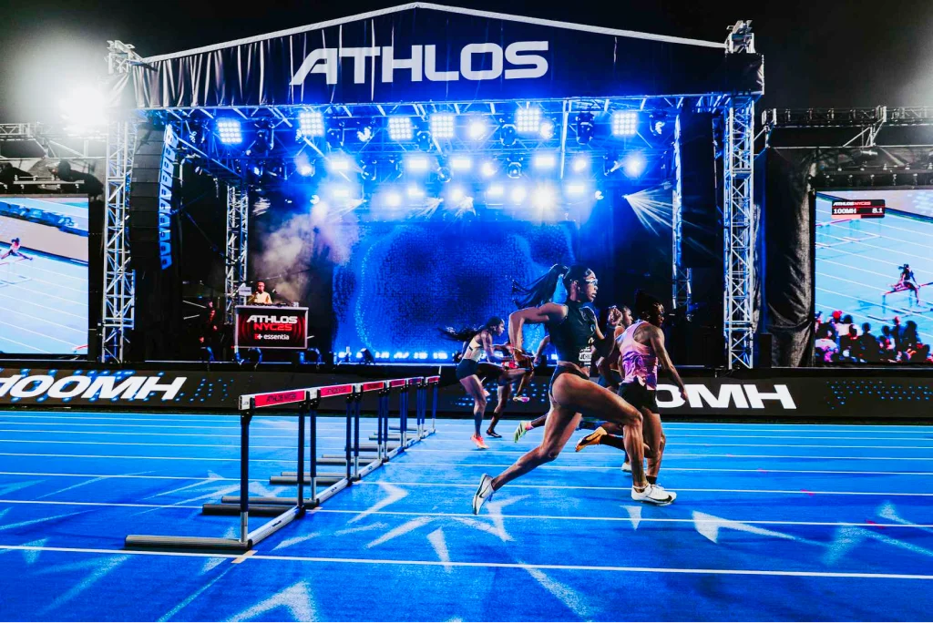 Athletes competing at night at the Athlos 776 Invitational